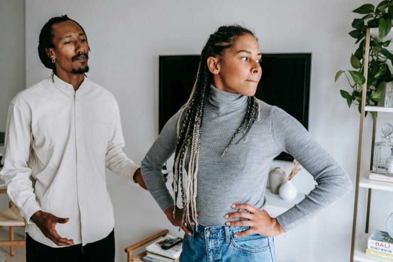 man explaining himself to disappointed woman