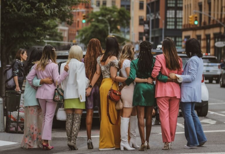 well-dressed women posing in street
