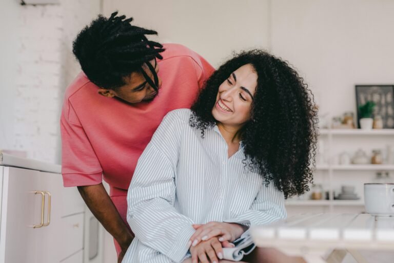 man smiling at smiling woman