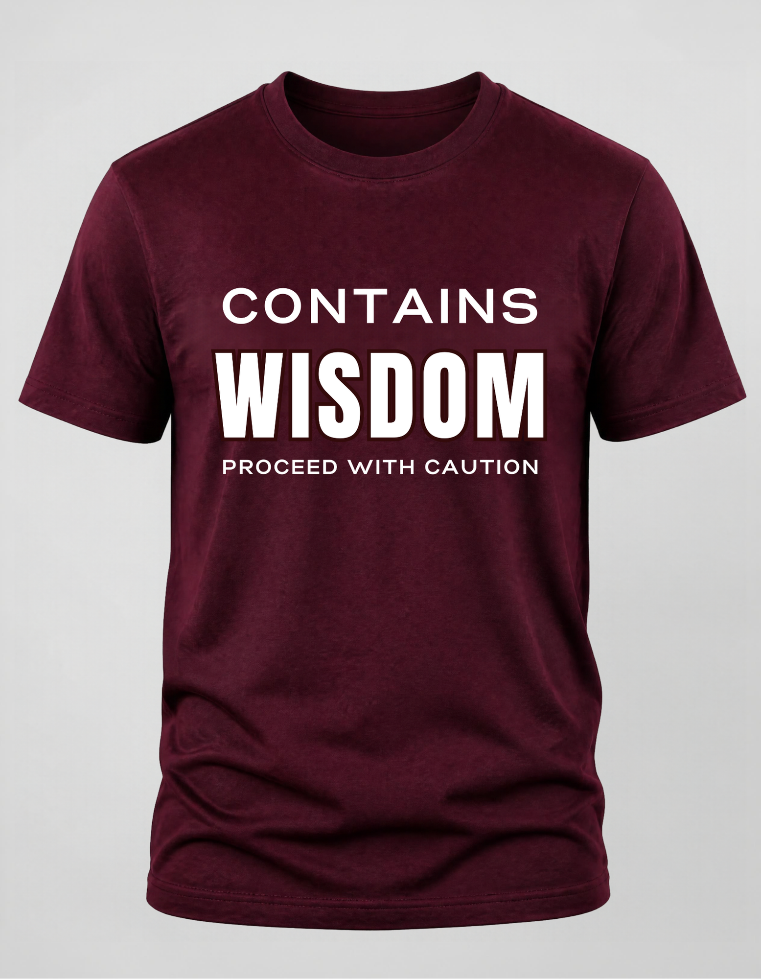 Maroon t-shirt with the text "Contains Wisdom Proceed with Caution"