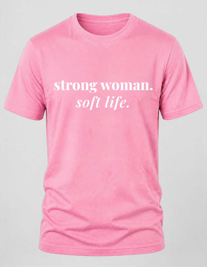 Pink t-shirt with text "Strong Woman, Soft Life"